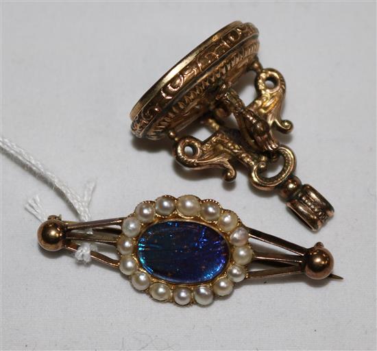 An Edwardian gold and split pearl set brooch and a gold plated and carnelian fob seal.